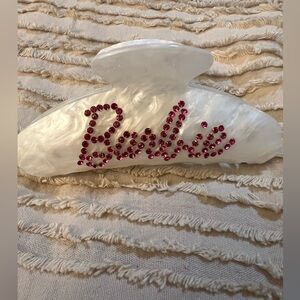 NWOT  - Barbie ivory hair clip , with pink rhinestone saying Barbie  front /back